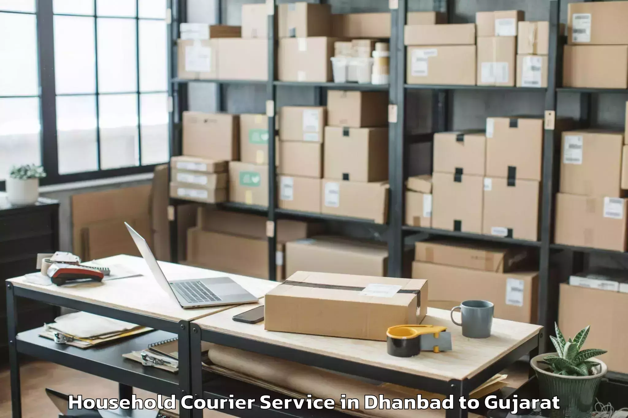 Book Your Dhanbad to Madhavpur Household Courier Today